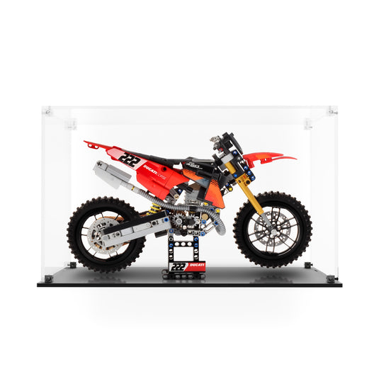LEGO 42238 Ducati Desmo450 MX motorcycle in a clear acrylic display case with a black base