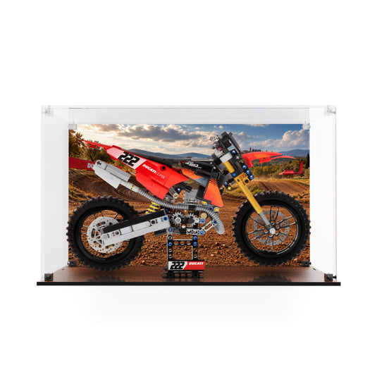 LEGO 42238 Ducati Desmo450 MX motorcycle in an acrylic display case with printed motocross backdrop and matching printed base